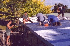 Putting on the roof.